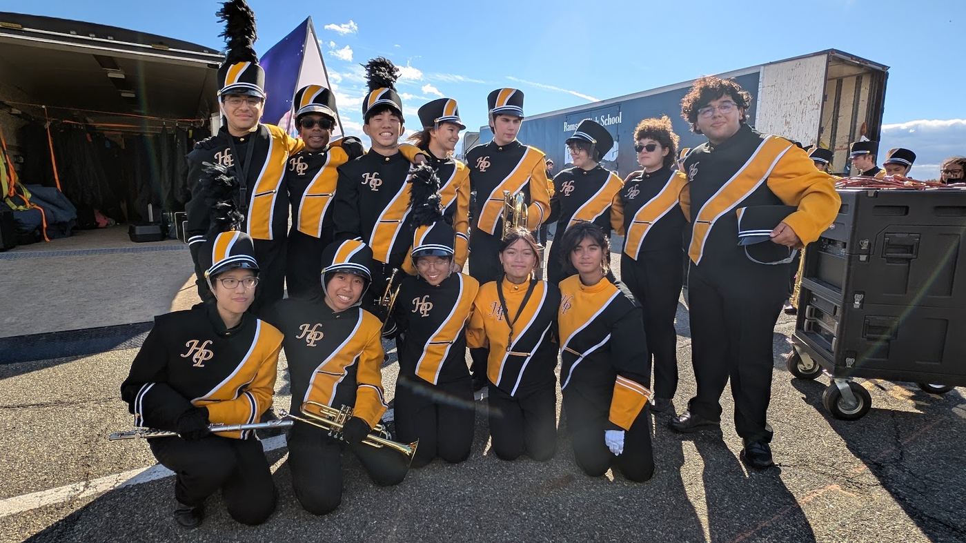 Band members posing together on a bright fall day
